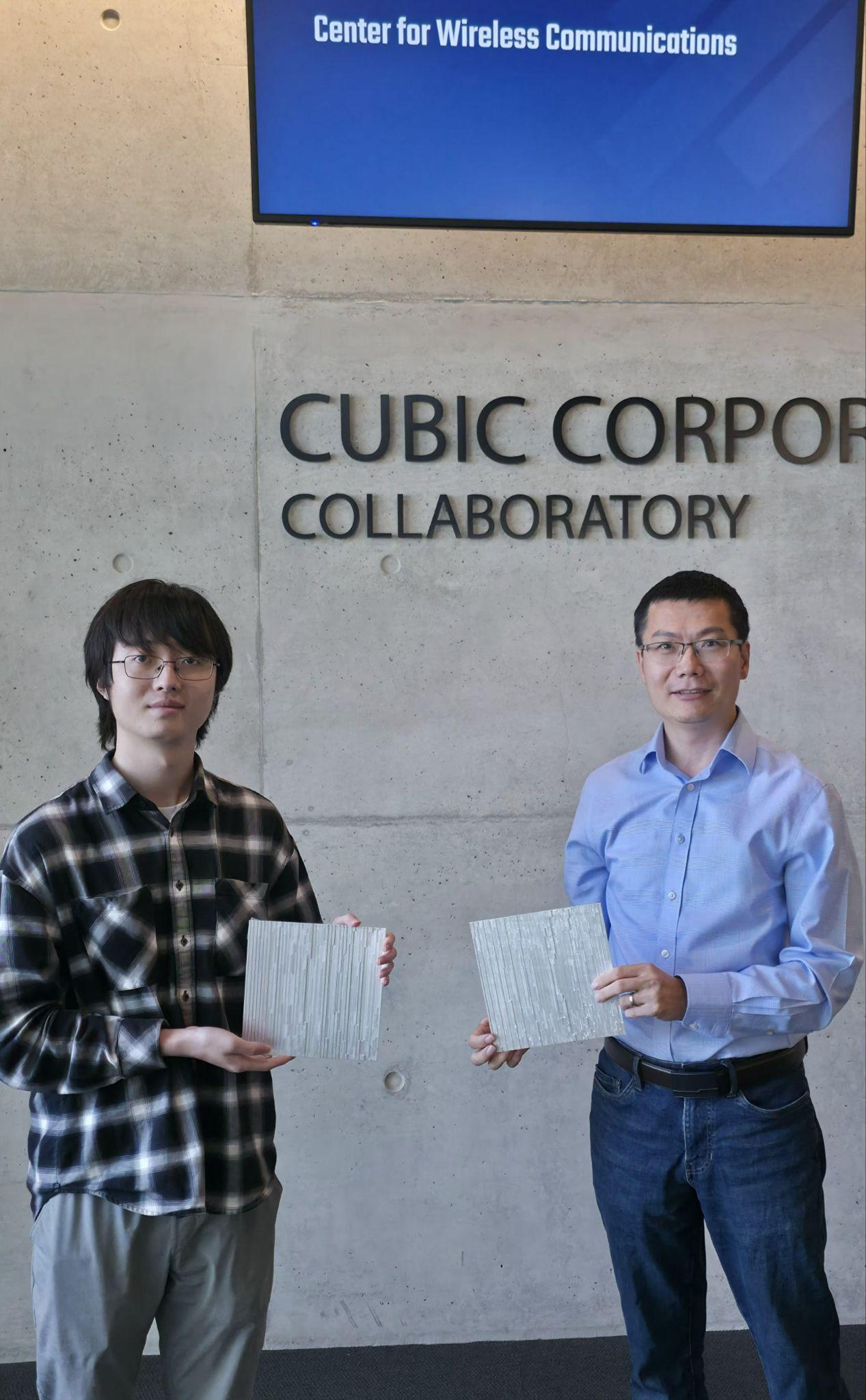 Wuqiong Zhao and Prof. Xinyu Zhang holding 3D-printed passive metasurface tiles